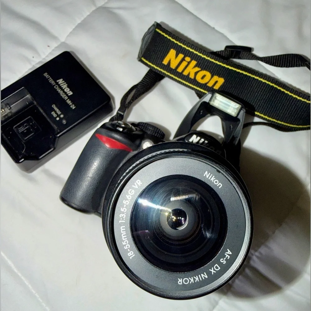 Nikon D3100 DSLR Camera with 18-55mm f/3.5-5.6 Auto Focus-S Nikkor Zoom Lens